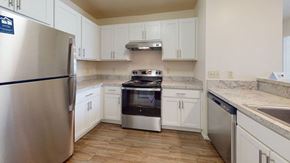 Oak Creek apartment for rent - a renovated two bedroom kitchen with stainless steel appliances and white cabinets at Oak Shores Apartments, Oak Creek, Wisconsin