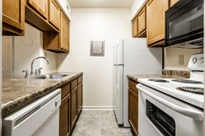 Lafayette apartment for rent - a kitchen with white appliances at Pheasant Run Apartments, Indiana