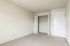 Indianapolis apartment for rent - a bedroom with a closet and an open door at Scarborough Lake Apartments, Indianapolis, IN, 46254