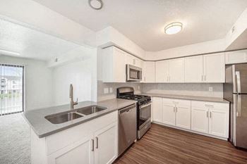 Kitchen with dishwasher and gas range