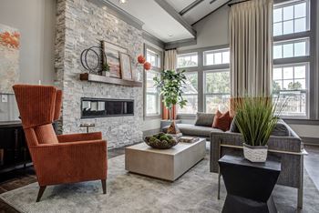 A living room with a fireplace and a chair.