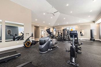 A gym with various exercise equipment