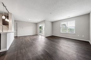 Roanoke apartment for rent - A spacious room with wood flooring and a fireplace on the left side. at Sunscape Apartments, Virginia