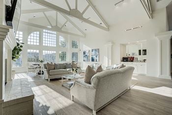 A living room with a couch and a television.