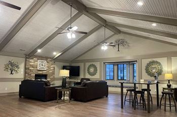 Community building with a high ceiling and fireplace