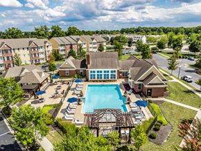 Columbus apartment for rent - an aerial view of the resort style pool with lounge chairs around it at The Avenue at Polaris Apartments, Ohio