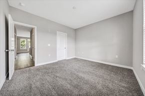 Roanoke apartment for rent - A spacious room with grey carpeting and white walls at The Retreat Apartments, Roanoke, 24019