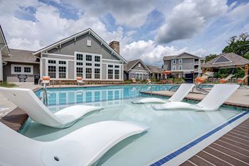 A swimming pool with a slide in the middle of it.