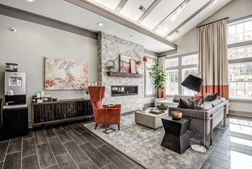 Roanoke apartment for rent - A modern living room with a fireplace and a large painting on the wall.
