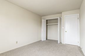Evansville apartment for rent - a bedroom with a closet and an open door at The Timbers Apartments, Evansville, IN, 47715