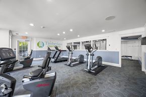 Peoria apartment for rent - A gym with treadmills and elliptical machinesk at Timberlane Apartments, Peoria, Illinois