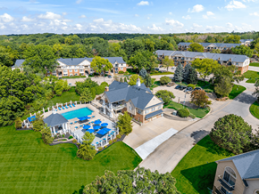 Peoria apartment for rent - A large house with a pool surrounded by trees at Timberlane Apartments, Illinois, 61615