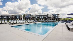 Dublin apartment for rent - Swimming Pool Area With Shaded Chairs at Upper Vue Flats, Dublin, OH, Ohio, 43016