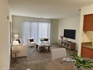 Novi apartment for rent - a living room with a table and chairs and a television