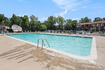 Outdoor pool with lounge chairs 