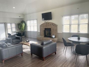 Elkhorn apartment for rent - a living room with couches and chairs and a fireplace