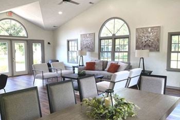 Community building with high ceiling and wood flooring at 