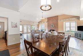 Mishawaka townhouse for rent - A clubhouse dining room with a wooden table and chairs at Autumn Lakes Apartments and Townhomes, Mishawaka, IN