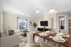 Kennewick apartment for rent - A dining room with a wooden table set for a meal.