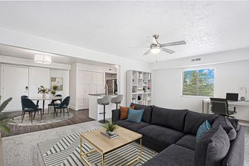 Byron Center apartment for rent - A living room with a grey couch and a coffee table.