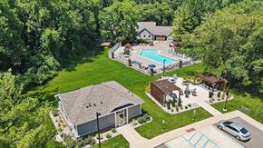 Byron Center apartment for rent - Aerial view of swimming pool and outdoor amenity spaces at Byron Lakes Apartments, Byron Center, MI
