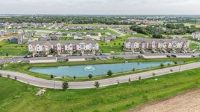 Maize apartment for rent - A large aerial view of a residential area with a swimming pool.