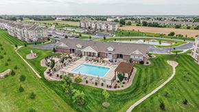 Maize apartment for rent - Aerial view of clubhouse pool and surrounding green space at Copper Creek Homes Apartments, Maize, KS