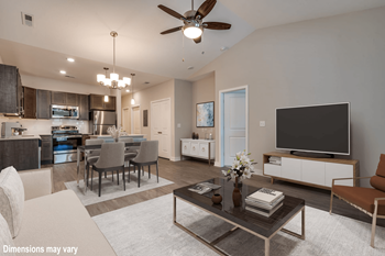 A spacious living room with a large flat screen tv on top of a coffee table