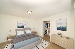 Portage townhouse for rent - a bedroom with a bed and a walk-in closet at Foxwood and The Hermitage, Portage