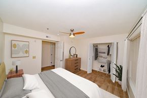 Madison apartment for rent - a bedroom with a bed and a ceiling fan at Limestone Creek Apartment Homes, Madison, AL
