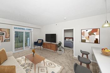 Living room with a 9 foot ceiling to a private balcony 