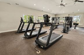Madison apartment for rent - A spacious gym with treadmills and other exercise equipment at Limestone Creek Apartment Homes, 35756
