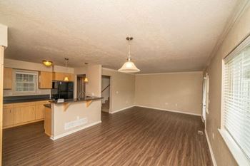 Living room and kitchen with a vinyl plank floor