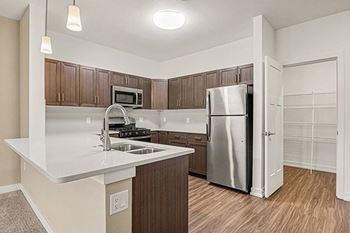 Kitchen with breakfast bar and pantry offered