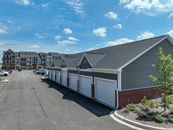 A row of garages with a blue sky in the background