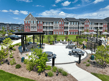 An outdoor area with picnic tables and benches