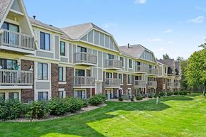 Michigan City apartment for rent - Apartment complex with green lawn in front.