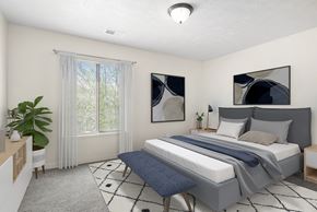 Elkhart apartment for rent - A bedroom with a large bed and a window with curtains at Old Farm Apartments, Elkhart, Indiana