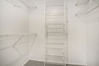 Walk-in closet with wardrobe organizers