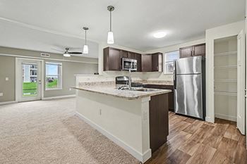 Kitchen with breakfast bar and pantry