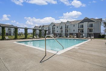 Refreshing outdoor pool with pergola and sundeck