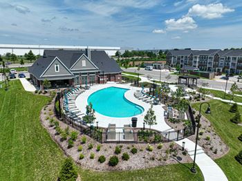 Sparkling swimming pool with expansive sundeck