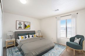 Kalamazoo apartment for rent - a bedroom with a large window at Seville Apartments, Kalamazoo, MI, 49009