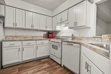 Fort Wayne apartment for rent - A kitchen with white cabinets and appliances.