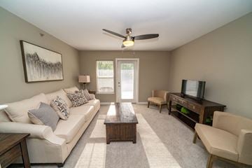 West Des Moines apartment for rent - a living room with a couch and a table