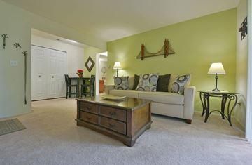 Lake Orion apartment for rent - a living room with a couch and a coffee table