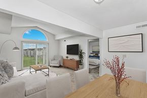 Kalamazoo apartment for rent - a living room with a cathedral ceiling at Tall Oaks Apartment Homes, Michigan
