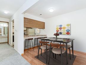 Oak Creek apartment for rent - A kitchen and a dining table set for two at Tanglewood Apartments, Oak Creek