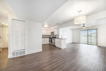 Dining and living rooms with hard surface flooring 