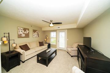 Grimes apartment for rent - a living room with a couch and a tv